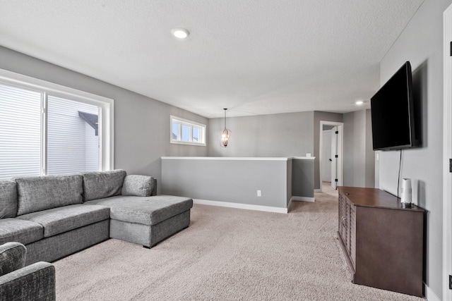 1401 142nd Ct E, Rosemount, MN 55068 - living area with light carpet, baseboards, and a textured ceiling