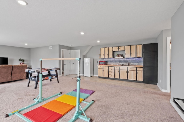 1401 142nd Ct E, Rosemount, MN 55068 - workout area featuring light colored carpet, baseboards, recessed lighting, and bar