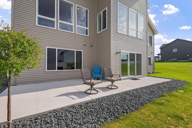 1401 142nd Ct E, Rosemount, MN 55068 - back of house with a lawn and a patio area