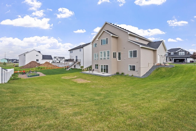 1401 142nd Ct E, Rosemount, MN 55068 - back of property featuring a yard and a patio area