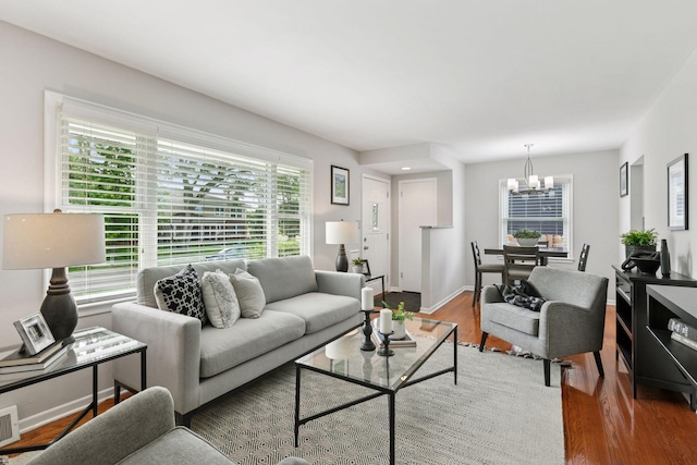 3636 Sumter Ave S, Saint Louis Park, MN 55426 - living room featuring wood finished floors and a chandelier