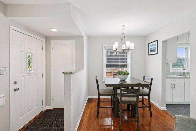 3636 Sumter Ave S, Saint Louis Park, MN 55426 - dining area with a chandelier and dark wood finished floors