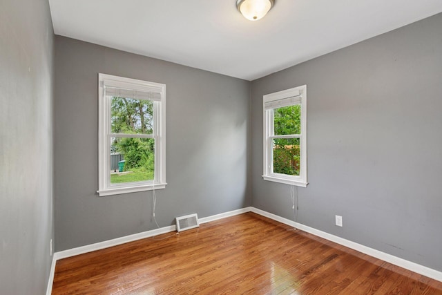3636 Sumter Ave S, Saint Louis Park, MN 55426 - empty room with baseboards and wood finished floors