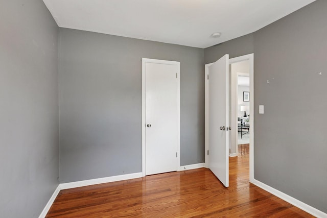 3636 Sumter Ave S, Saint Louis Park, MN 55426 - unfurnished bedroom with wood finished floors and baseboards