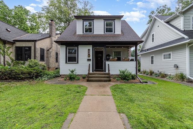 1848 James Ave, Saint Paul, MN 55105 - bungalow featuring a front yard, a porch, and a shingled roof