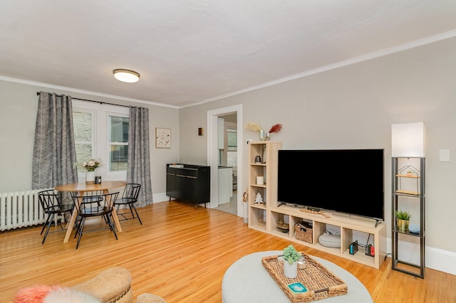 1848 James Ave, Saint Paul, MN 55105 - living room with radiator heating unit, crown molding, and wood finished floors