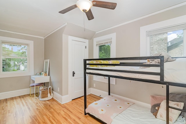 1848 James Ave, Saint Paul, MN 55105 - bedroom featuring ornamental molding, light wood-type flooring, multiple windows, and ceiling fan