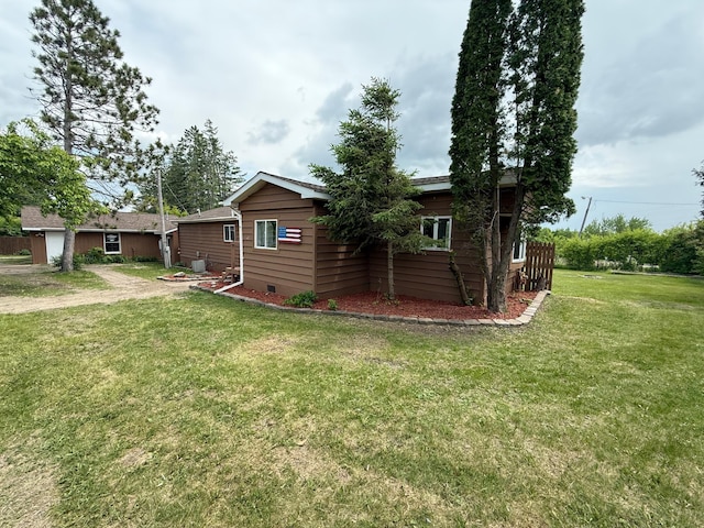110 9th Ave NE, Deer River, MN 56636 - view of property exterior featuring a yard and an attached garage