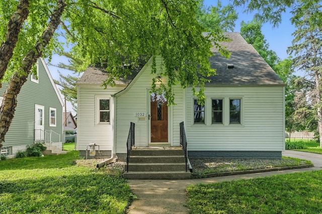 1032 Scheffer Ave, Saint Paul, MN 55102 - view of front of house featuring a front lawn and a shingled roof