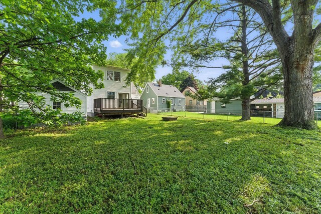 1032 Scheffer Ave, Saint Paul, MN 55102 - view of yard with a wooden deck and a fire pit