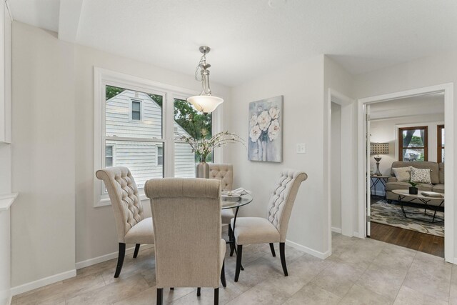 1032 Scheffer Ave, Saint Paul, MN 55102 - dining area with plenty of natural light and baseboards