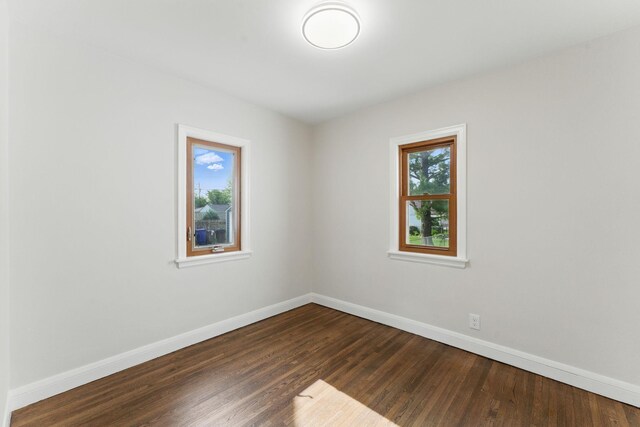 1032 Scheffer Ave, Saint Paul, MN 55102 - spare room with baseboards and dark wood finished floors