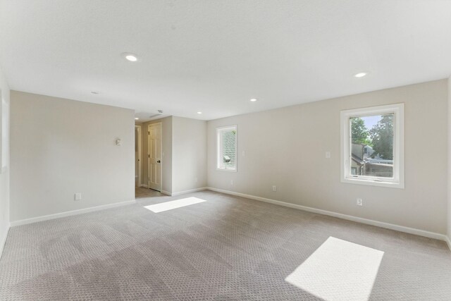 1032 Scheffer Ave, Saint Paul, MN 55102 - unfurnished room with light colored carpet, recessed lighting, and baseboards