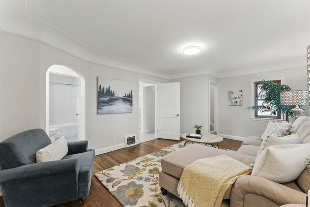 1032 Scheffer Ave, Saint Paul, MN 55102 - living room with baseboards, dark wood finished floors, and arched walkways