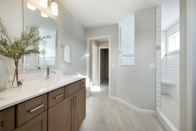 19648 104th Pl, Corcoran, MN 55374 - full bath with double vanity, a walk in shower, and baseboards