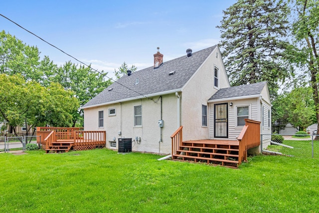 148 5th Ave N, Hopkins, MN 55343 - back of house featuring a shingled roof, a wooden deck, stucco siding, and a chimney