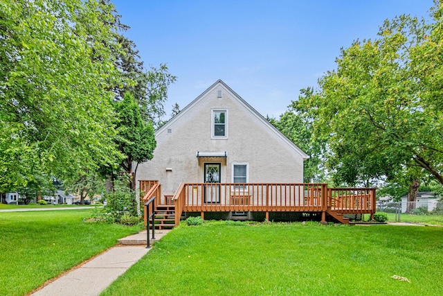 148 5th Ave N, Hopkins, MN 55343 - back of property with stucco siding and a wooden deck