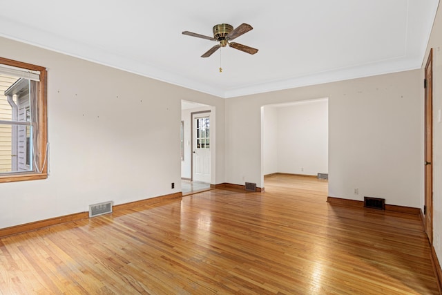 148 5th Ave N, Hopkins, MN 55343 - spare room with a ceiling fan, crown molding, and light wood-type flooring