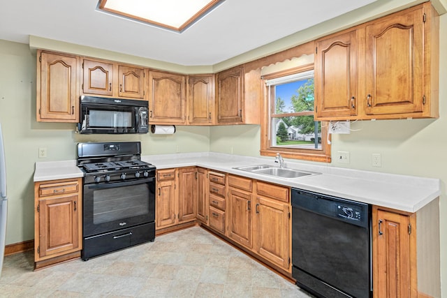 148 5th Ave N, Hopkins, MN 55343 - kitchen with black appliances, light countertops, and brown cabinets