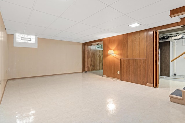 148 5th Ave N, Hopkins, MN 55343 - below grade area featuring wood walls and a drop ceiling