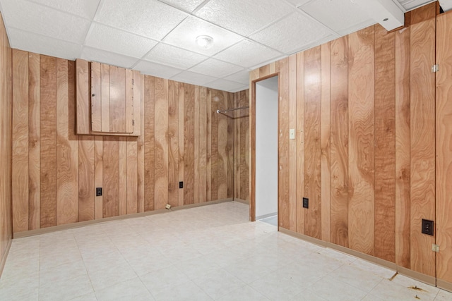 148 5th Ave N, Hopkins, MN 55343 - finished basement featuring wooden walls, tile patterned floors, and a drop ceiling
