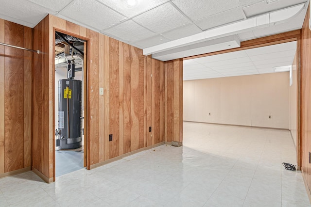 148 5th Ave N, Hopkins, MN 55343 - finished below grade area featuring gas water heater, wooden walls, a paneled ceiling, and light flooring