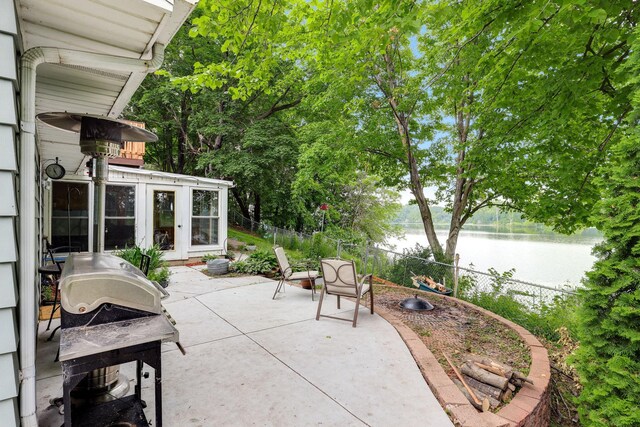 1060 Greer Ave NW, Albion Twp, MN 55358 - view of patio featuring a water view and a grill