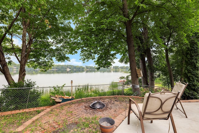 1060 Greer Ave NW, Albion Twp, MN 55358 - view of patio featuring a water view and an outdoor fire pit