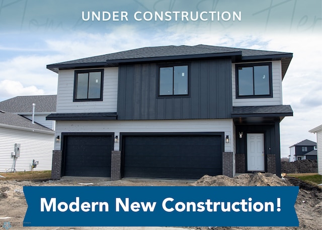 6856 Meadow View Dr S, Fargo, ND 58104 - view of front of home featuring board and batten siding, an attached garage, brick siding, and roof with shingles