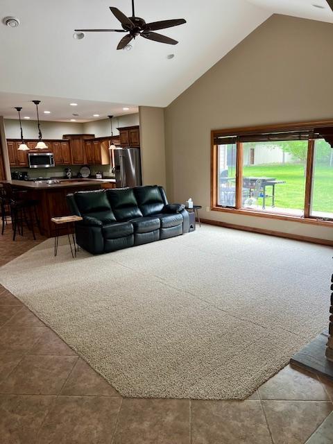 23567 Timber Trail Dr, Bemidji, MN 56601 - living room with a ceiling fan, high vaulted ceiling, recessed lighting, and tile patterned floors