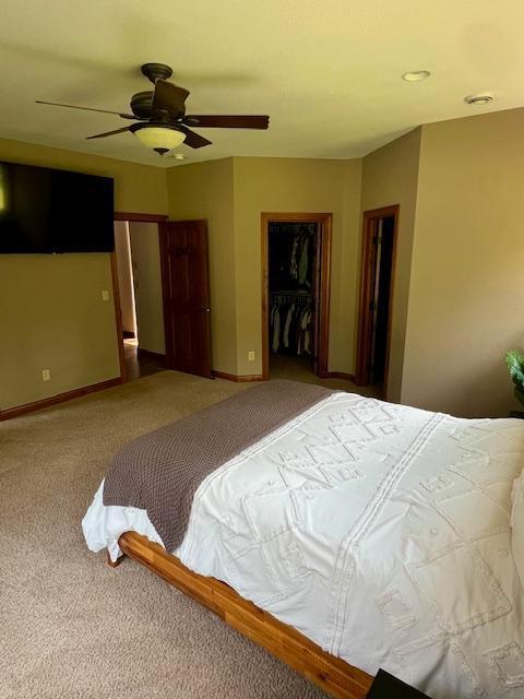 23567 Timber Trail Dr, Bemidji, MN 56601 - bedroom with carpet floors, a ceiling fan, a closet, a spacious closet, and baseboards