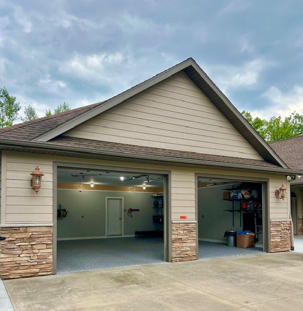23567 Timber Trail Dr, Bemidji, MN 56601 - garage featuring concrete driveway