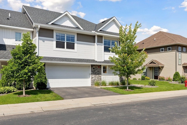 13824 102nd Pl N, Maple Grove, MN 55369 - multi unit property featuring asphalt driveway, roof with shingles, a garage, and a front lawn