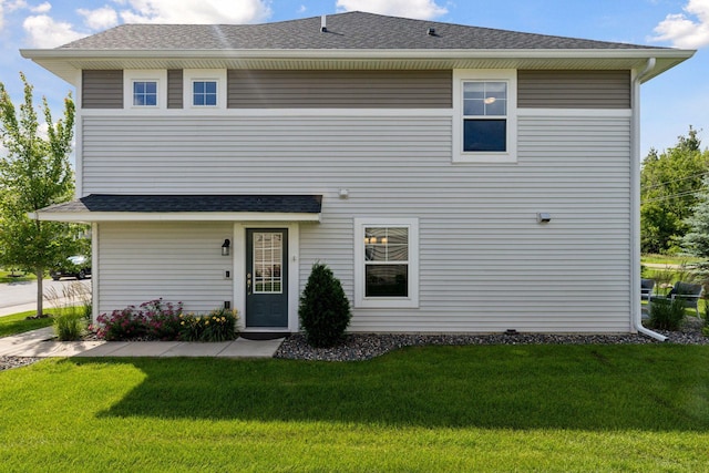 13824 102nd Pl N, Maple Grove, MN 55369 - rear view of house with a yard and roof with shingles