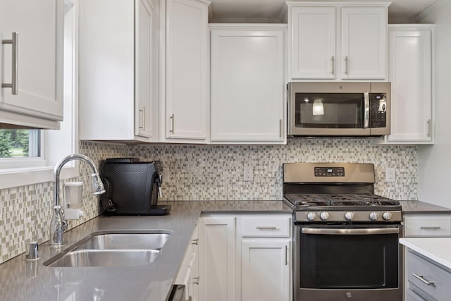 13824 102nd Pl N, Maple Grove, MN 55369 - kitchen with stainless steel appliances, white cabinetry, decorative backsplash, and light countertops