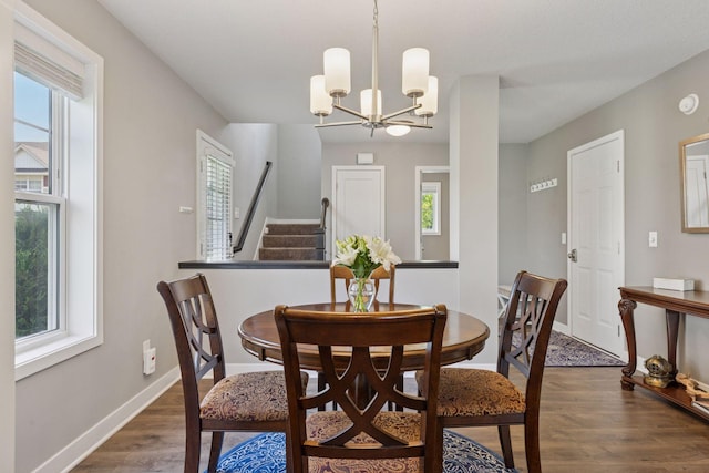 13824 102nd Pl N, Maple Grove, MN 55369 - dining room with healthy amount of natural light, dark wood-style flooring, and a chandelier