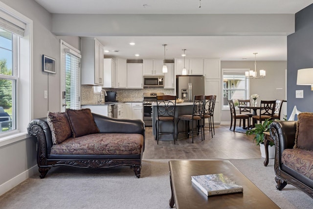 13824 102nd Pl N, Maple Grove, MN 55369 - living area featuring a chandelier, recessed lighting, and light wood-style flooring