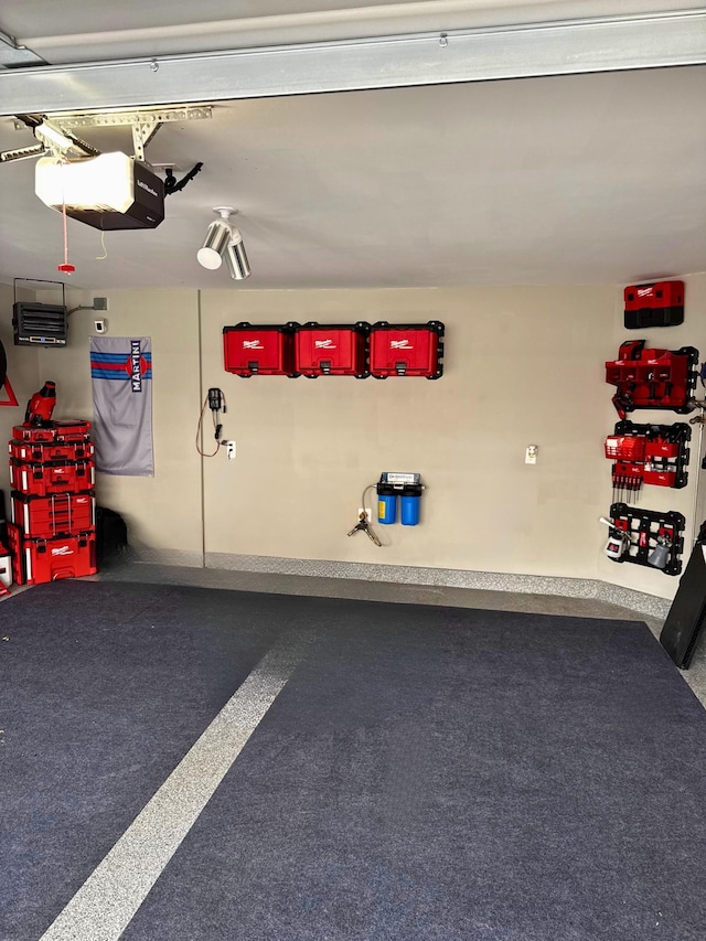 13824 102nd Pl N, Maple Grove, MN 55369 - garage featuring a garage door opener and baseboards