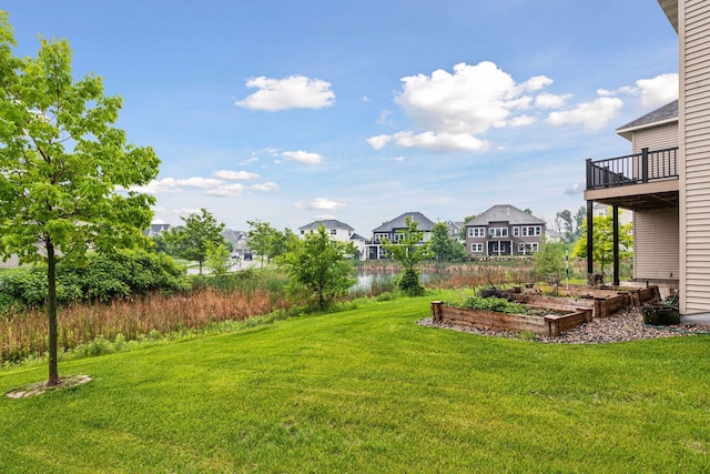 19086 100th Pl N, Maple Grove, MN 55311 - view of grassy yard featuring a residential view and a vegetable garden