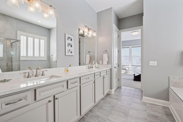 19086 100th Pl N, Maple Grove, MN 55311 - ensuite bathroom featuring double vanity, a stall shower, and healthy amount of natural light