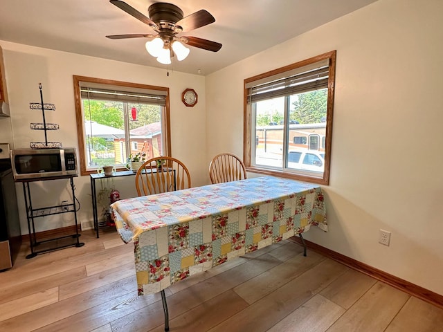 303 Goad Dr, Wrenshall, MN 55797 - dining space with light wood finished floors and ceiling fan