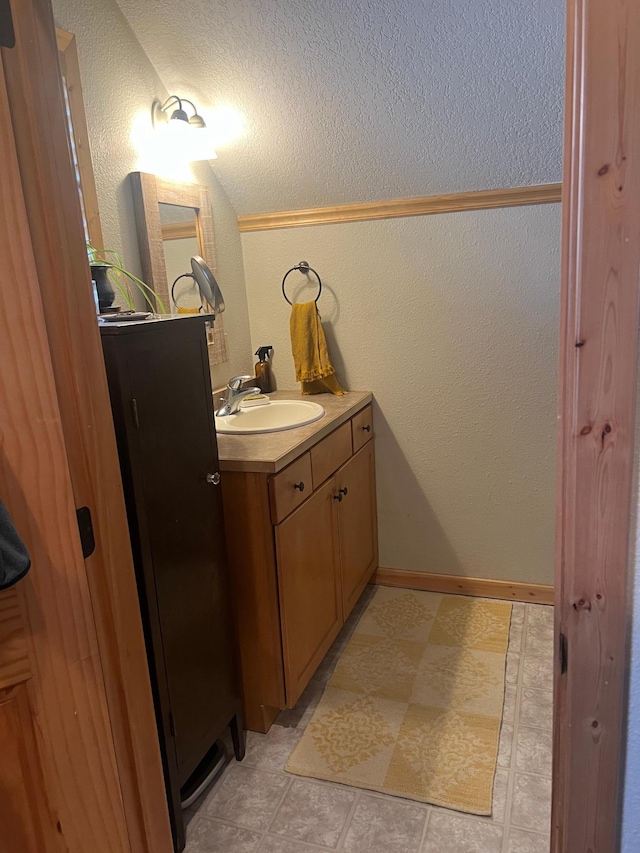 454 Wagon Wheel Dr SE Unit 17, Ten Lake Twp, MN 56601 - bathroom with vanity, a textured wall, and a textured ceiling