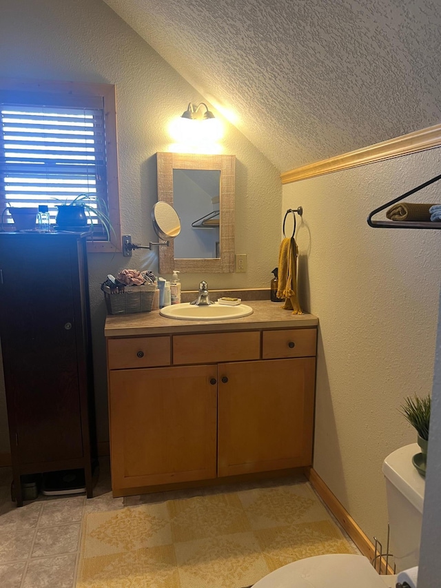 454 Wagon Wheel Dr SE Unit 17, Ten Lake Twp, MN 56601 - half bath with vaulted ceiling, vanity, a textured ceiling, and a textured wall