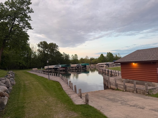 454 Wagon Wheel Dr SE Unit 17, Ten Lake Twp, MN 56601 - dock with a water view and a lawn