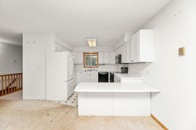 43394 Long Lake Ln, Ottertail, MN 56571 - kitchen with black appliances, a peninsula, light countertops, white cabinets, and light colored carpet