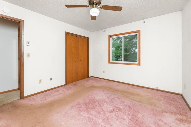 43394 Long Lake Ln, Ottertail, MN 56571 - unfurnished bedroom featuring carpet floors, a textured ceiling, a closet, and ceiling fan
