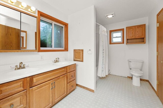 43394 Long Lake Ln, Ottertail, MN 56571 - full bathroom with toilet and double vanity