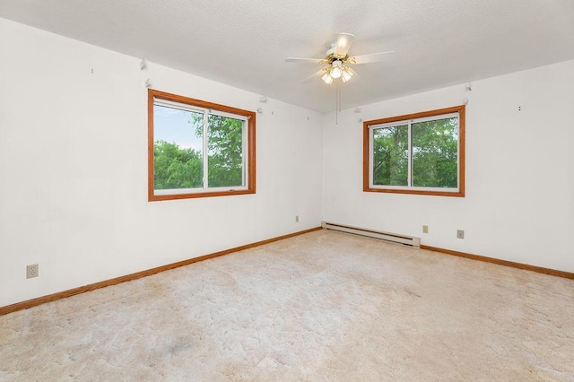 43394 Long Lake Ln, Ottertail, MN 56571 - unfurnished room with baseboard heating, ceiling fan, and carpet flooring