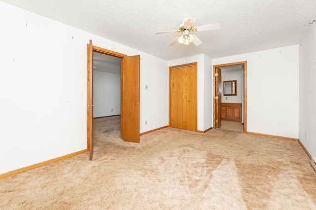 43394 Long Lake Ln, Ottertail, MN 56571 - unfurnished bedroom with carpet, a textured ceiling, a closet, and a ceiling fan