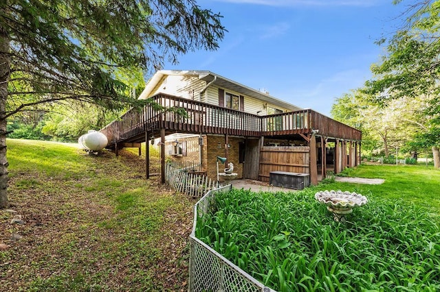43394 Long Lake Ln, Ottertail, MN 56571 - back of house featuring a deck, a lawn, and brick siding